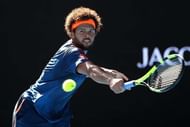 MELBOURNE, AUSTRALIA - JANUARY 24:  Jo-Wilfried Tsonga of France plays a backhand in his quarterfinal match against Stan Wawrinka of Switzerland on day nine of the 2017 Australian Open at Melbourne Park on January 24, 2017 in Melbourne, Australia.  (Photo by Cameron Spencer/Getty Images)